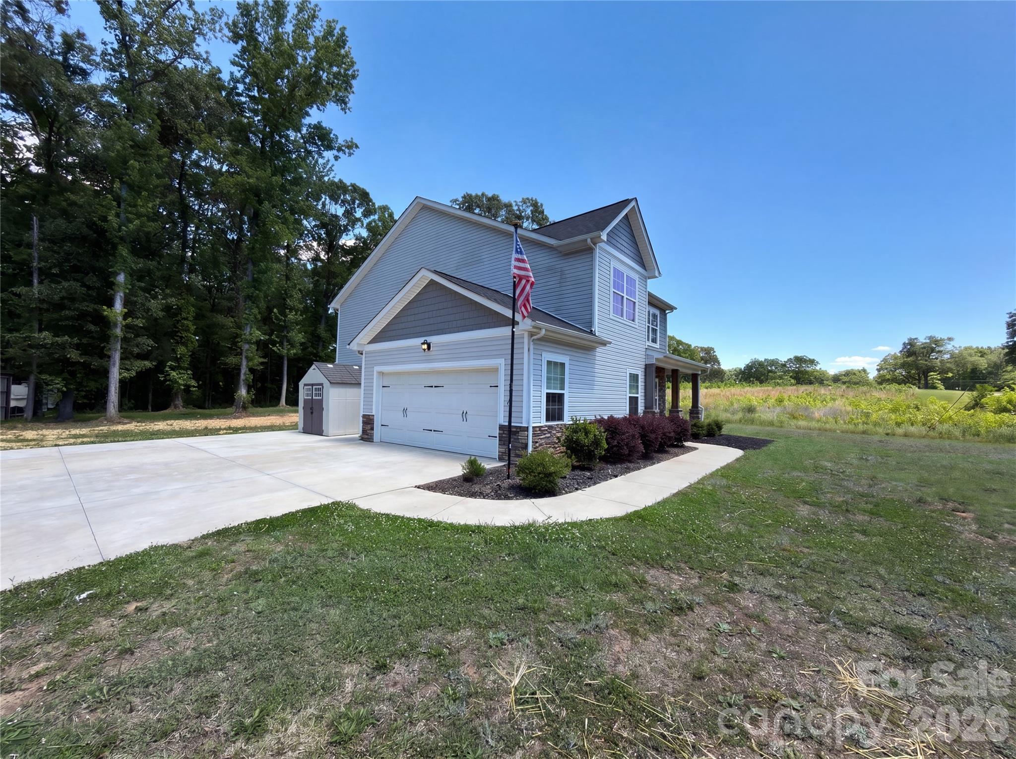 4918 Griffith Road Monroe, NC 28112 - Photo 15 of 17 a front view of a house with a yard and garage