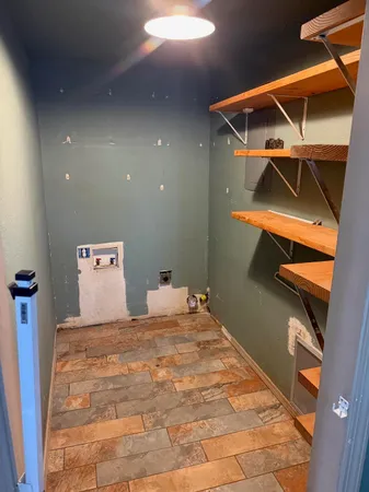 a bedroom with a bed and a ceiling fan