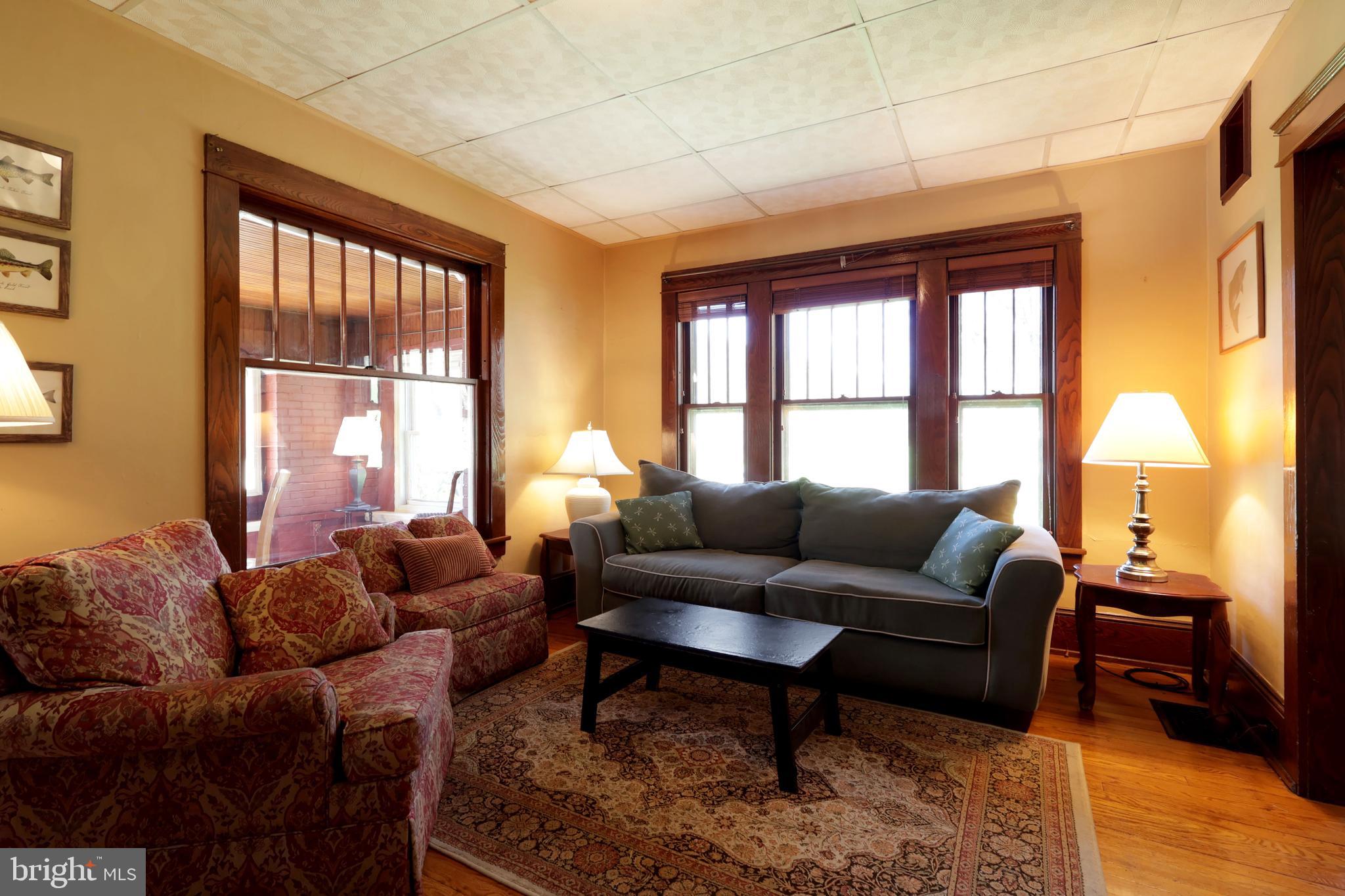 1343 Penns Creek Road Coburn, PA 16832 - Photo 12 of 92 a living room with furniture and a large window