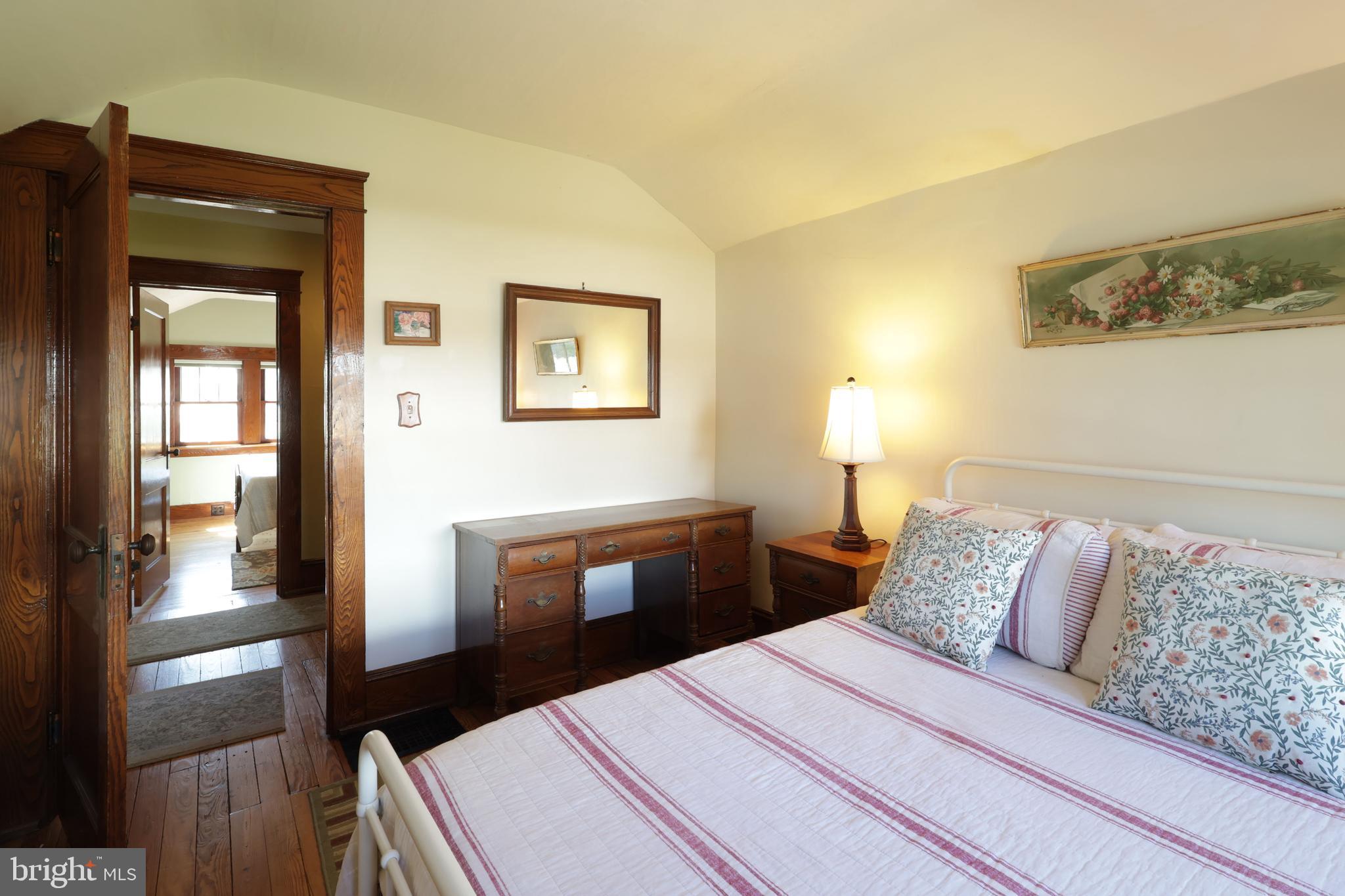 1343 Penns Creek Road Coburn, PA 16832 - Photo 29 of 92 a bedroom with a bed and wooden floor