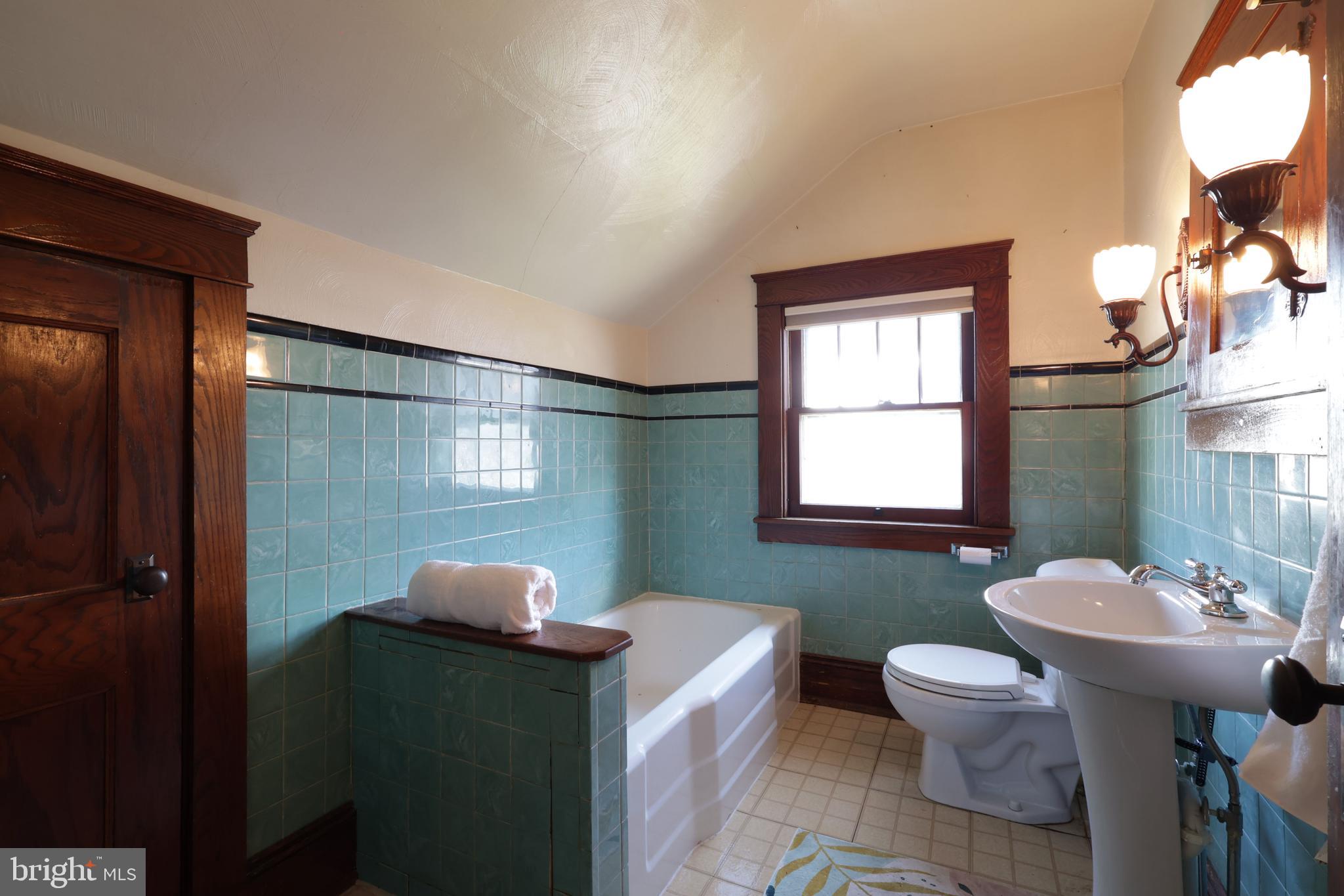 1343 Penns Creek Road Coburn, PA 16832 - Photo 30 of 92 a bathroom with a sink toilet and mirror