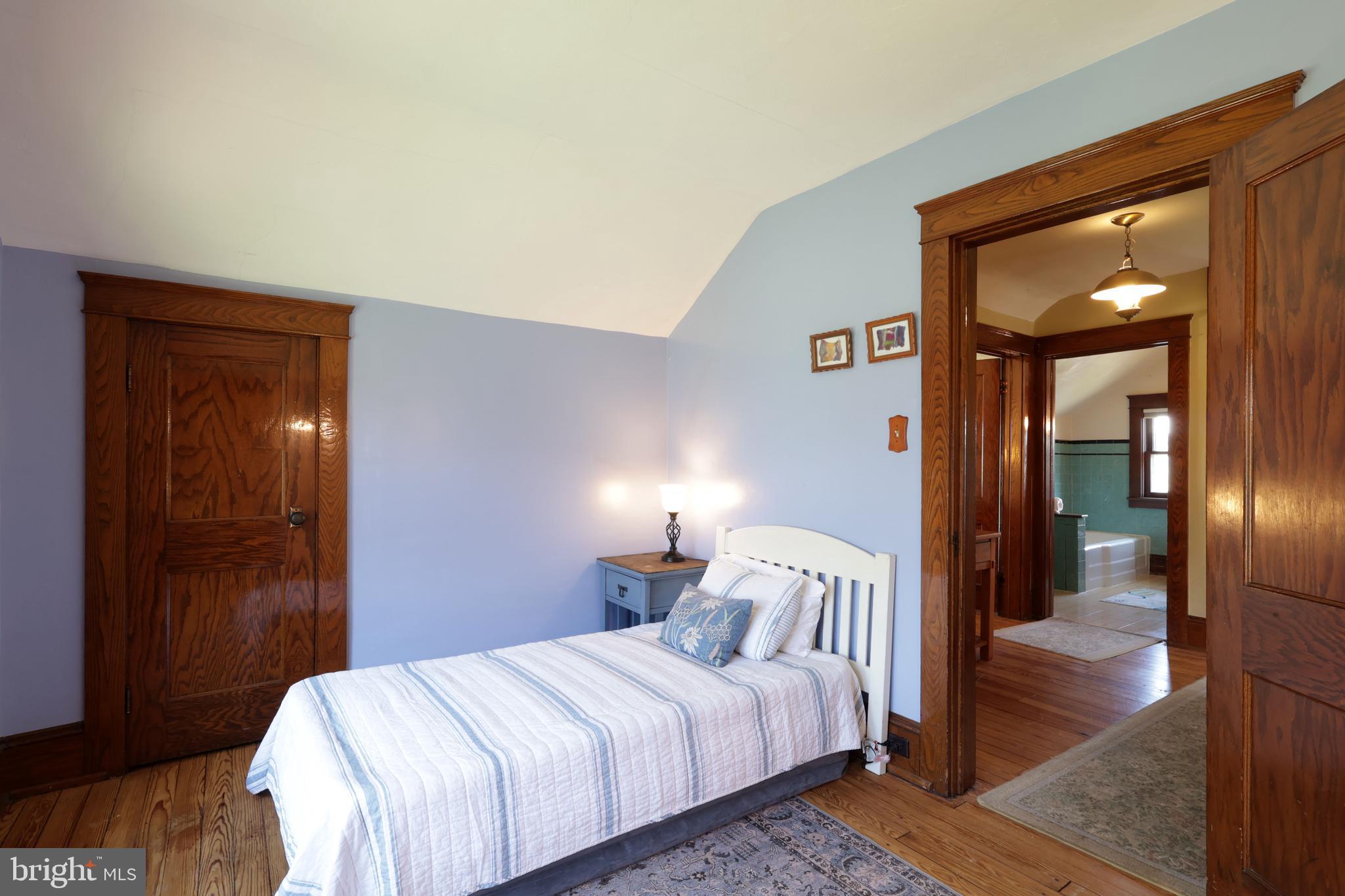 1343 Penns Creek Road Coburn, PA 16832 - Photo 36 of 92 a bedroom with a bed and a mirror