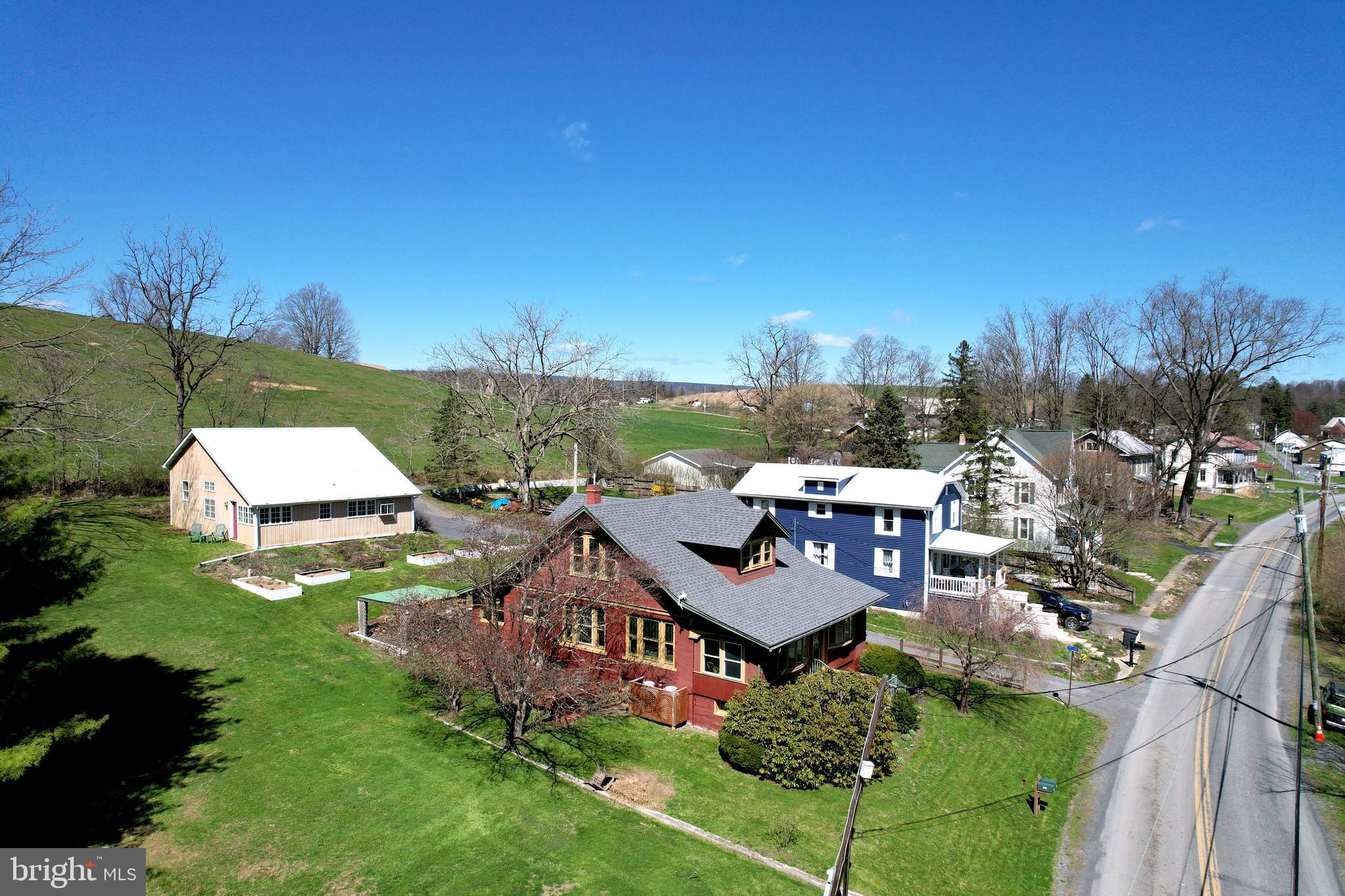 1343 Penns Creek Road Coburn, PA 16832 - Photo 4 of 92 an aerial view of a house with garden space and street view