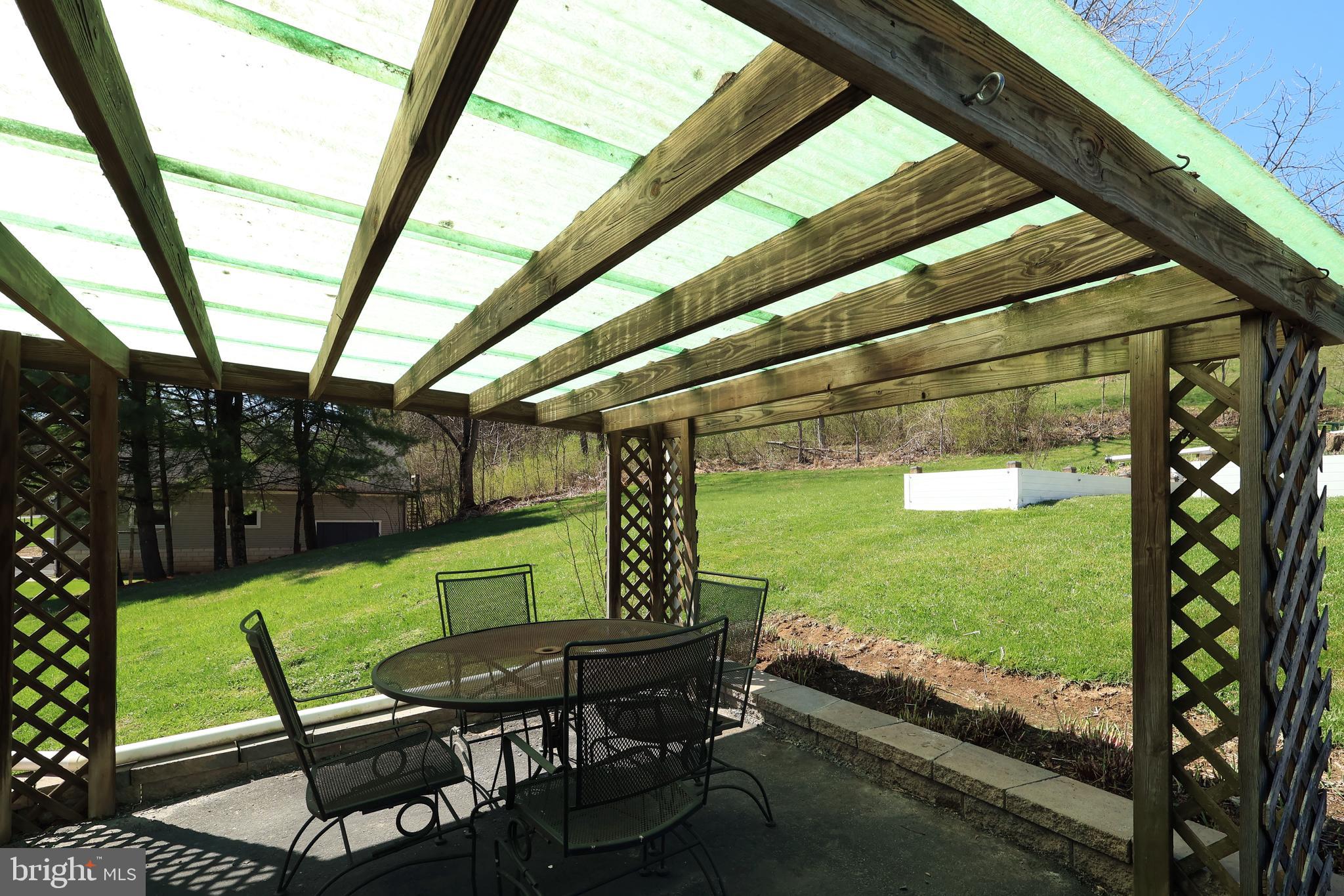 1343 Penns Creek Road Coburn, PA 16832 - Photo 41 of 92 a view of a chairs and table in patio with a yard