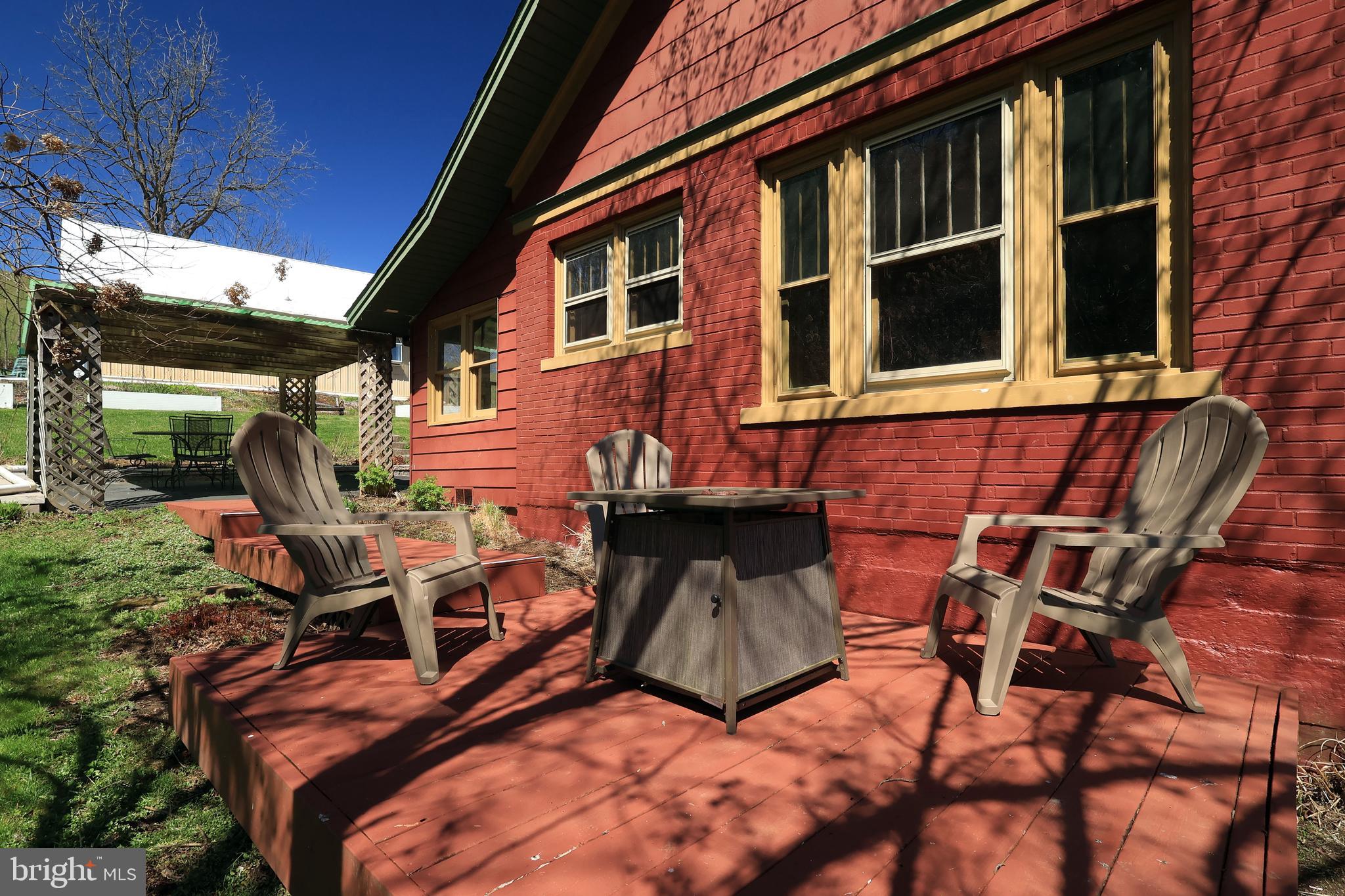 1343 Penns Creek Road Coburn, PA 16832 - Photo 43 of 92 a backyard of a house with seating space