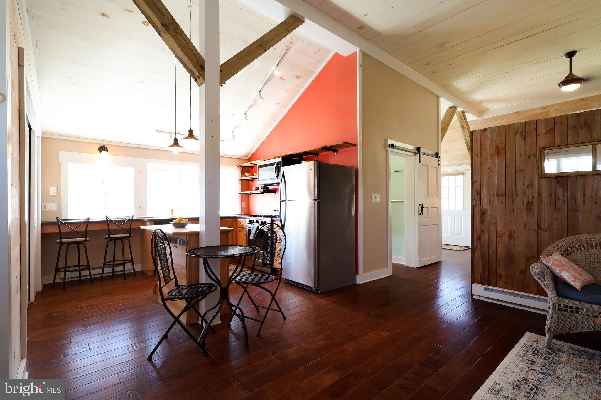 1343 Penns Creek Road Coburn, PA 16832 - Photo 51 of 92 a dining room with furniture entryway and wooden floor