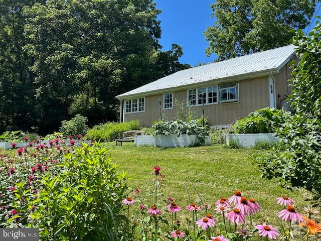 1343 Penns Creek Road Coburn, PA 16832 - Photo 62 of 92 a view of a house with a big yard and potted plants