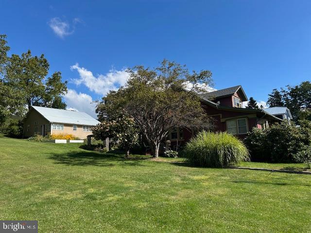 1343 Penns Creek Road Coburn, PA 16832 - Photo 65 of 92 a front view of a house with a yard
