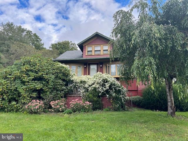 1343 Penns Creek Road Coburn, PA 16832 - Photo 88 of 92 a front view of a house with a garden and plants