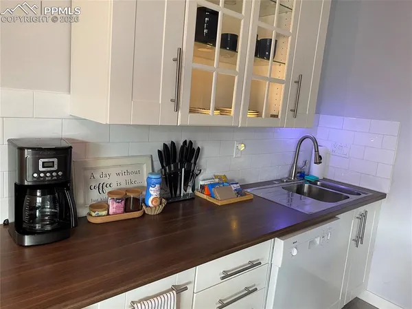 a kitchen with a sink and cabinets