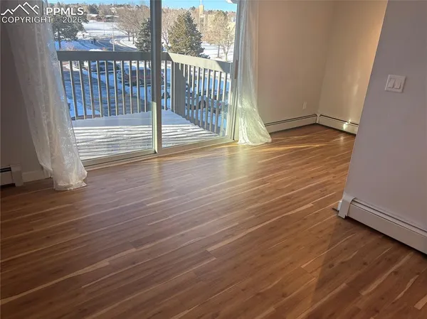 a view of a porch with wooden floor