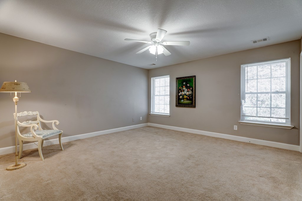 104 Nugget Lane Ellijay, GA 30540 - Photo 13 of 36 an empty room with windows and fan