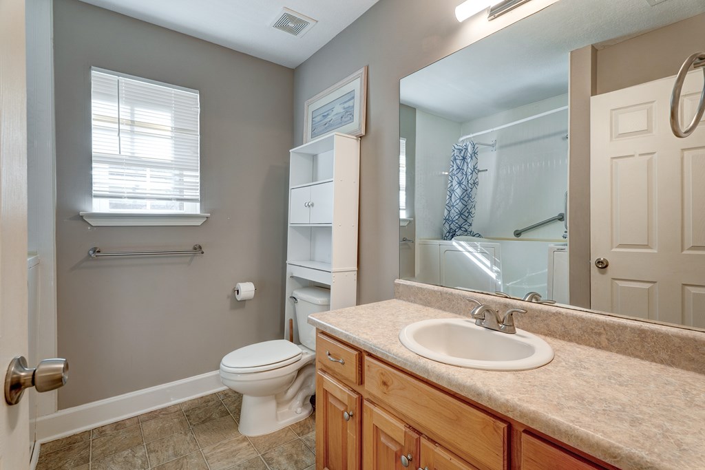 104 Nugget Lane Ellijay, GA 30540 - Photo 15 of 36 a bathroom with a granite countertop sink toilet and shower