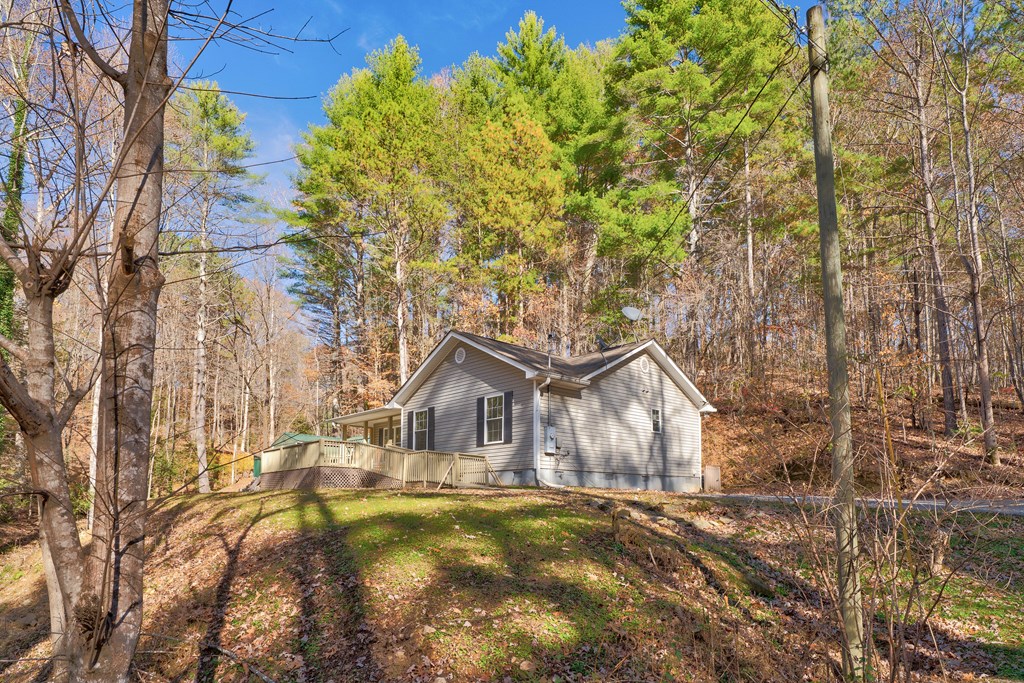 104 Nugget Lane Ellijay, GA 30540 - Photo 21 of 36 a front view of a house with garden