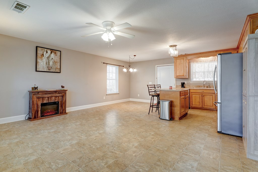 104 Nugget Lane Ellijay, GA 30540 - Photo 23 of 36 a kitchen with furniture and a fireplace