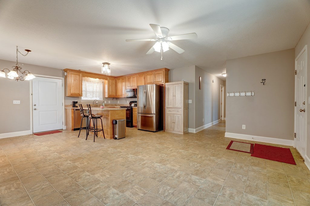 104 Nugget Lane Ellijay, GA 30540 - Photo 24 of 36 a view of a livingroom with furniture and a ceiling fan