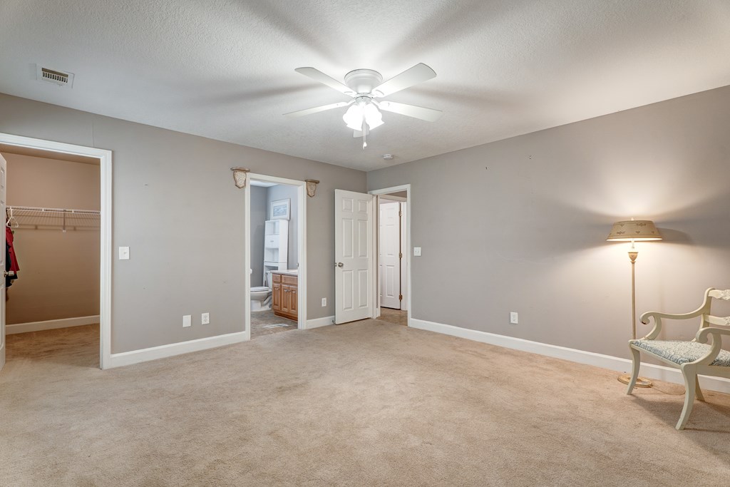 104 Nugget Lane Ellijay, GA 30540 - Photo 6 of 36 a view of an empty room with a ceiling fan