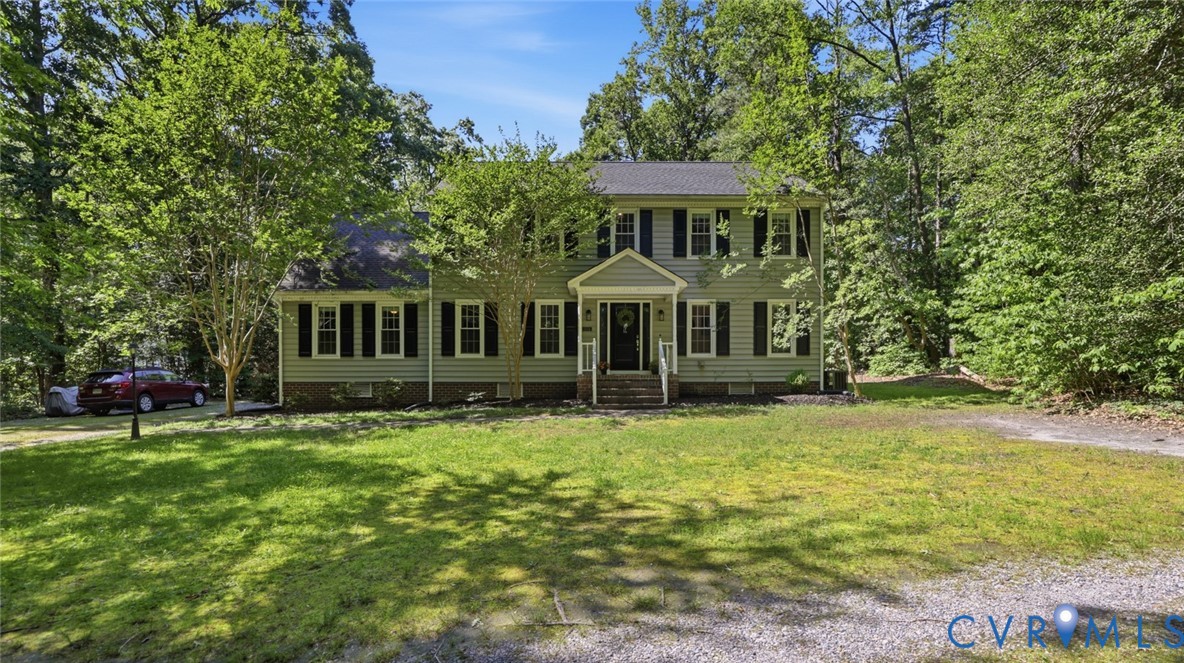 10716 Chalkley Road Richmond, VA 23237 - Photo 7 of 46 a front view of a house with a yard