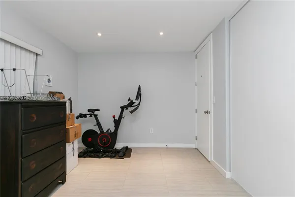 a view of a storage & utility room with two washing machine