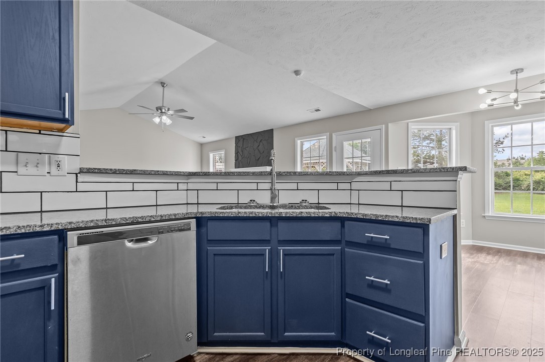 124 Quail Ridge Drive Raeford, NC 28376 - Photo 16 of 39 a kitchen with a sink and cabinets