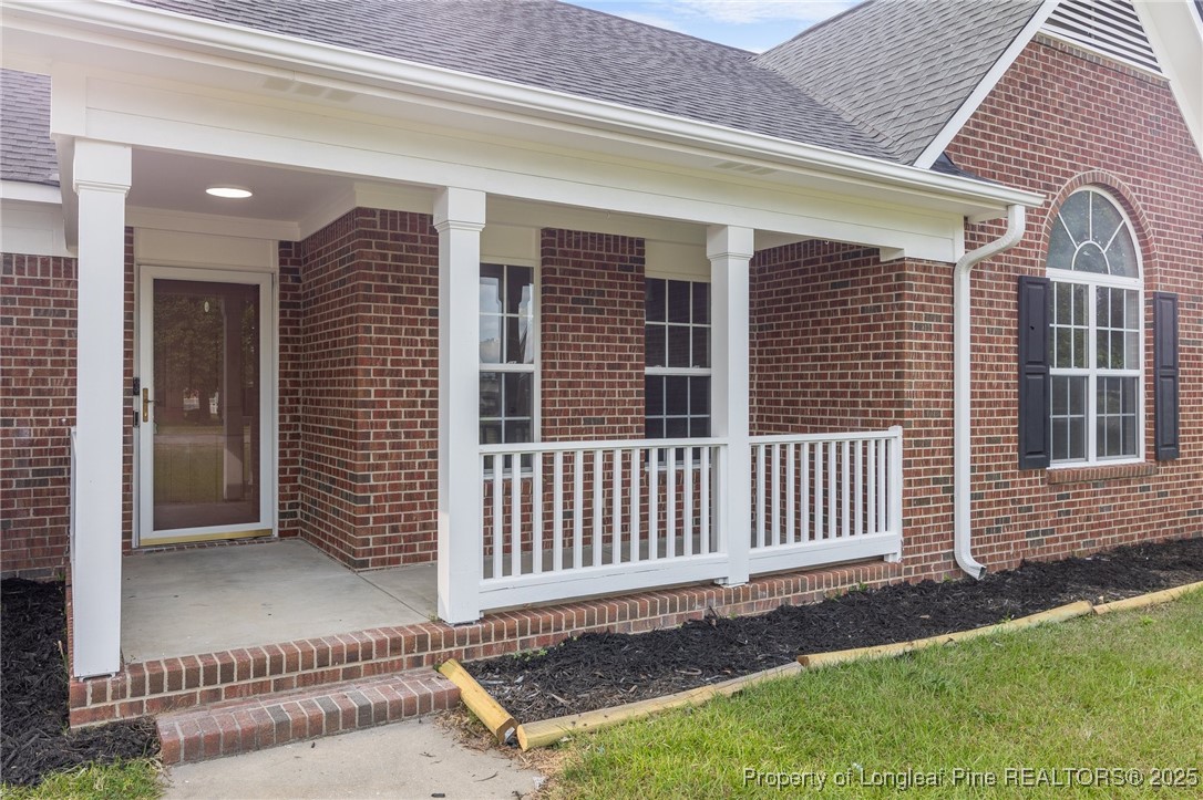 124 Quail Ridge Drive Raeford, NC 28376 - Photo 3 of 39 a front view of a house with a fence