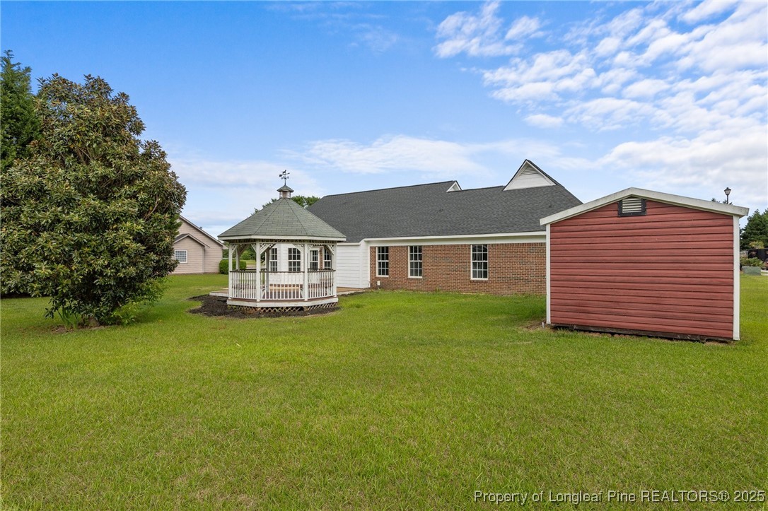 124 Quail Ridge Drive Raeford, NC 28376 - Photo 39 of 39 a front view of a house with garden