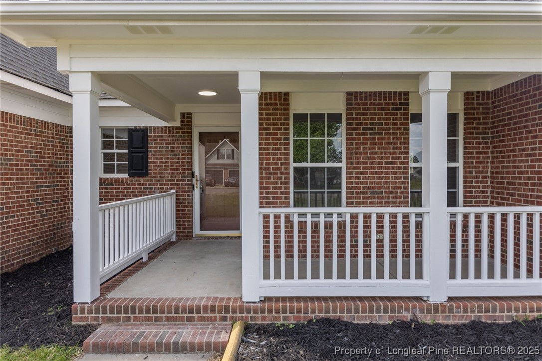 124 Quail Ridge Drive Raeford, NC 28376 - Photo 4 of 39 a view of a porch with a chair