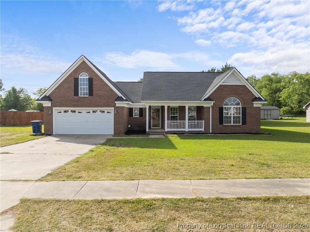 124 Quail Ridge Drive Raeford, NC 28376 - Photo 5 of 39 a front view of a house with a yard