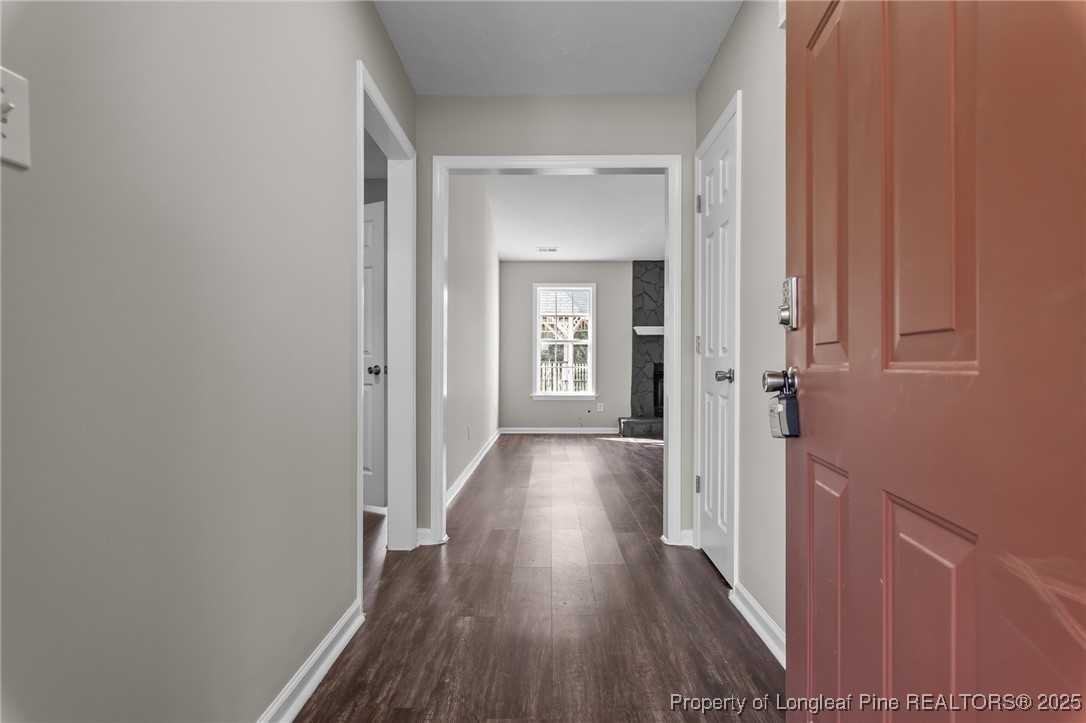 124 Quail Ridge Drive Raeford, NC 28376 - Photo 6 of 39 a view of a hallway with wooden floor