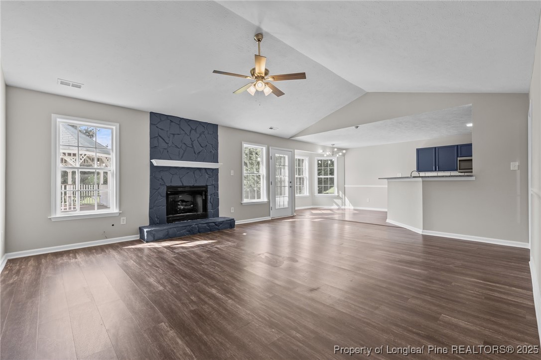 124 Quail Ridge Drive Raeford, NC 28376 - Photo 7 of 39 a view of empty room with wooden floor and fan