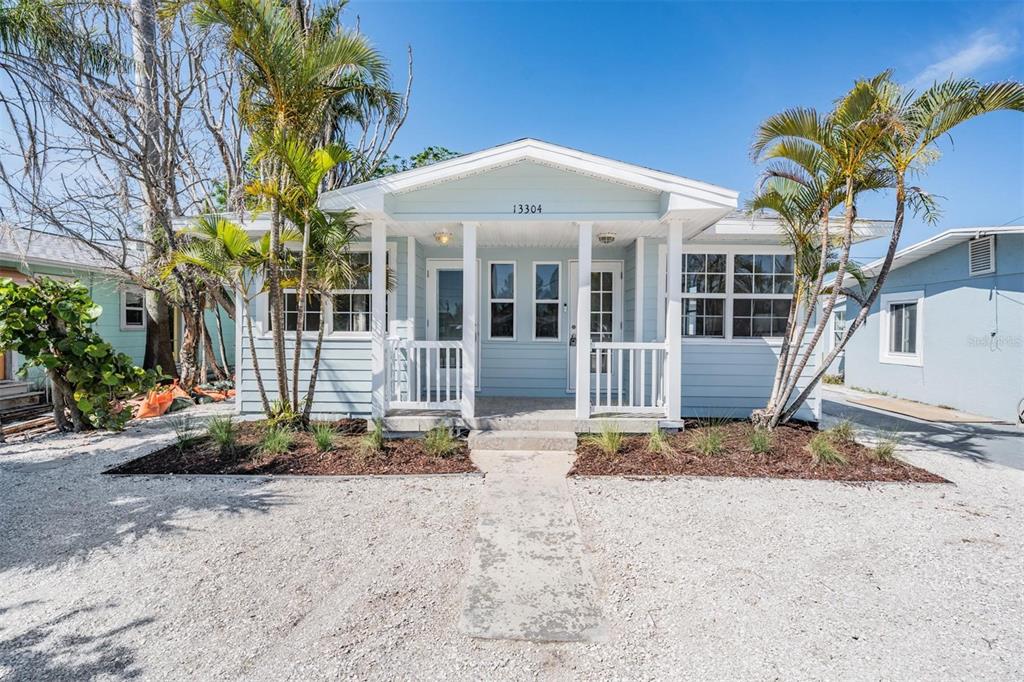 a front view of a house with a porch