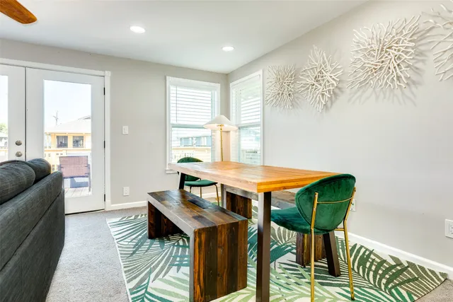 a dining room with furniture and wooden floor