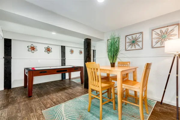 a view of a dining room with furniture and wooden floor