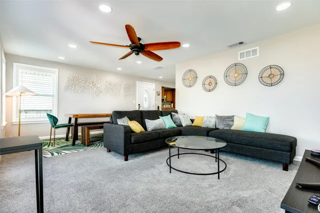 a living room with furniture and a window