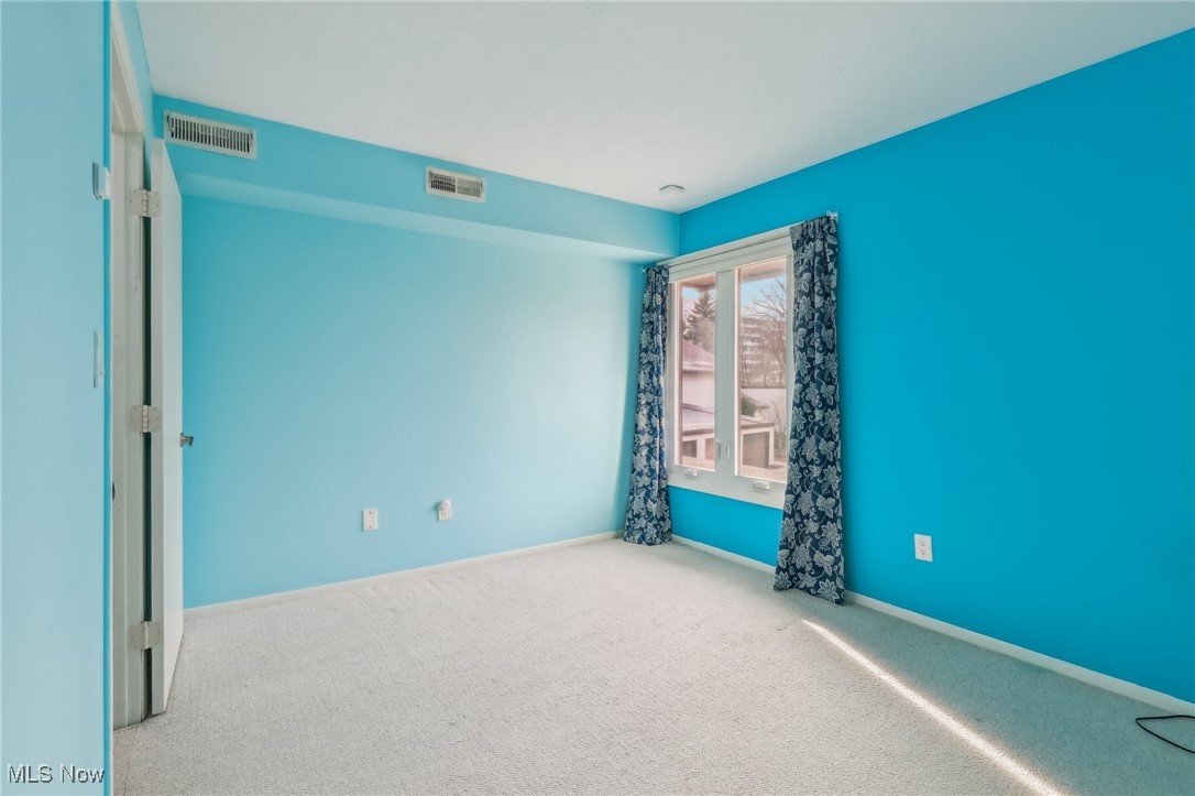 3484 Mayfield Road, Unit 3426 Cleveland Heights, OH 44118 - Photo 11 of 33 Carpeted empty room with baseboards and visible vents