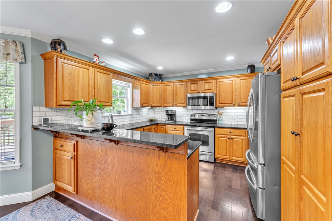 154 Hammond School Road Anderson, SC 29621 - Photo 10 of 33 This spacious kitchen offers a functional layout, abundant cabinetry, and durable flooring for daily living.