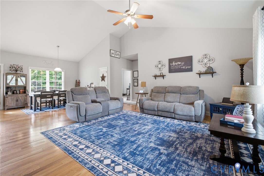 9433 Robin Road Disputanta, VA 23842 - Photo 4 of 26 Spacious living area featuring high vaulted ceilin