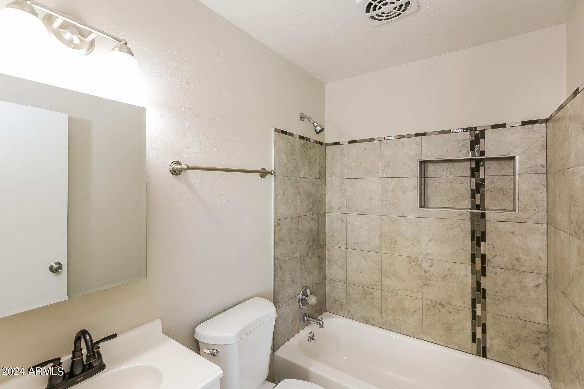 6963 West Pierson Street Phoenix, AZ 85033 - Photo 11 of 21 a bathroom with a toilet and shower