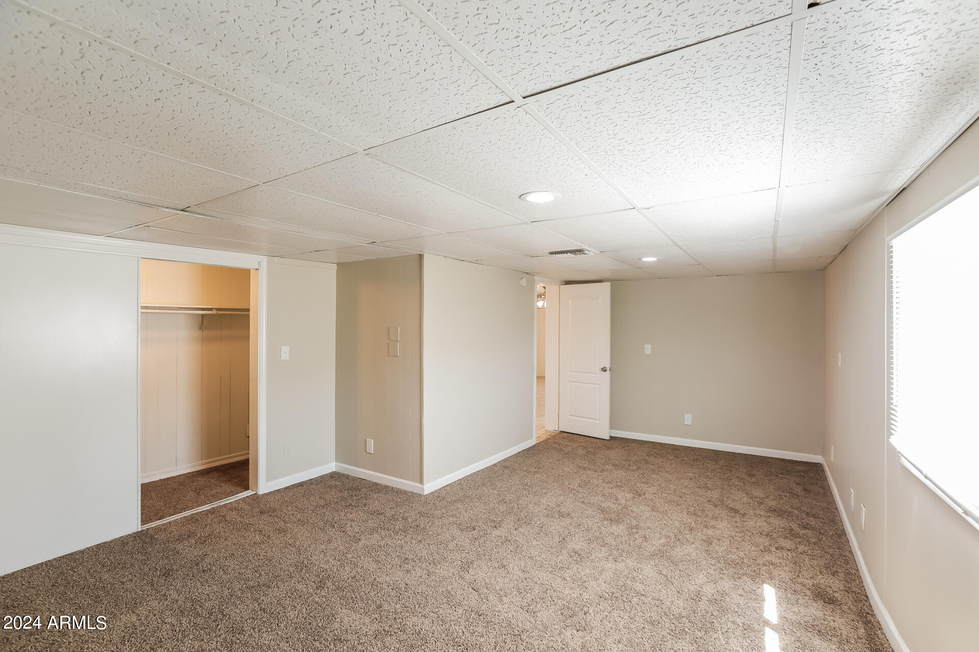 6963 West Pierson Street Phoenix, AZ 85033 - Photo 17 of 21 an empty room with windows