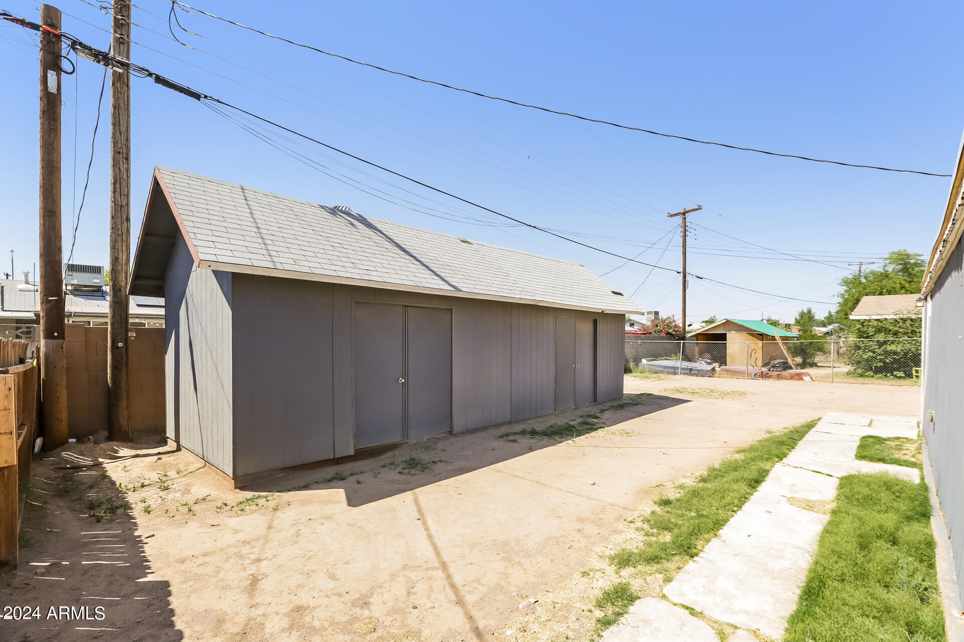 6963 West Pierson Street Phoenix, AZ 85033 - Photo 19 of 21 a view of a backyard of a house