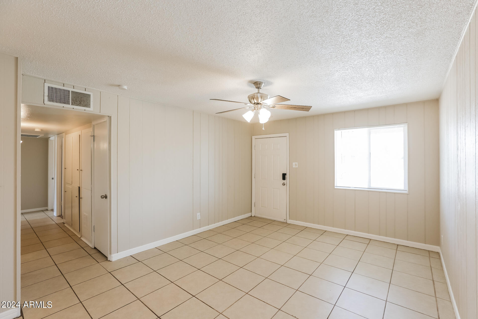 6963 West Pierson Street Phoenix, AZ 85033 - Photo 3 of 21 a view of an empty room with window