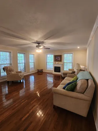a lobby with furniture and a flat screen tv