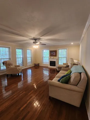 a lobby with furniture and a flat screen tv