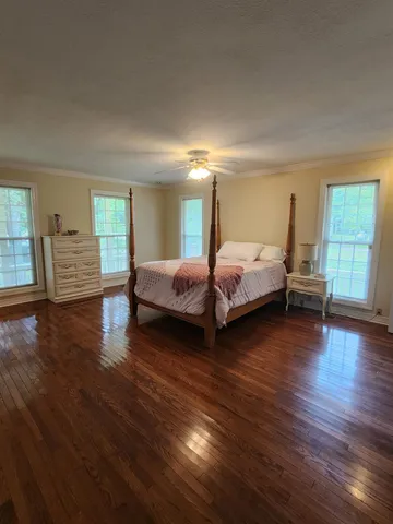 a room with furniture and a large window