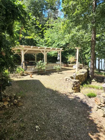 a view of yard with green space and seating area