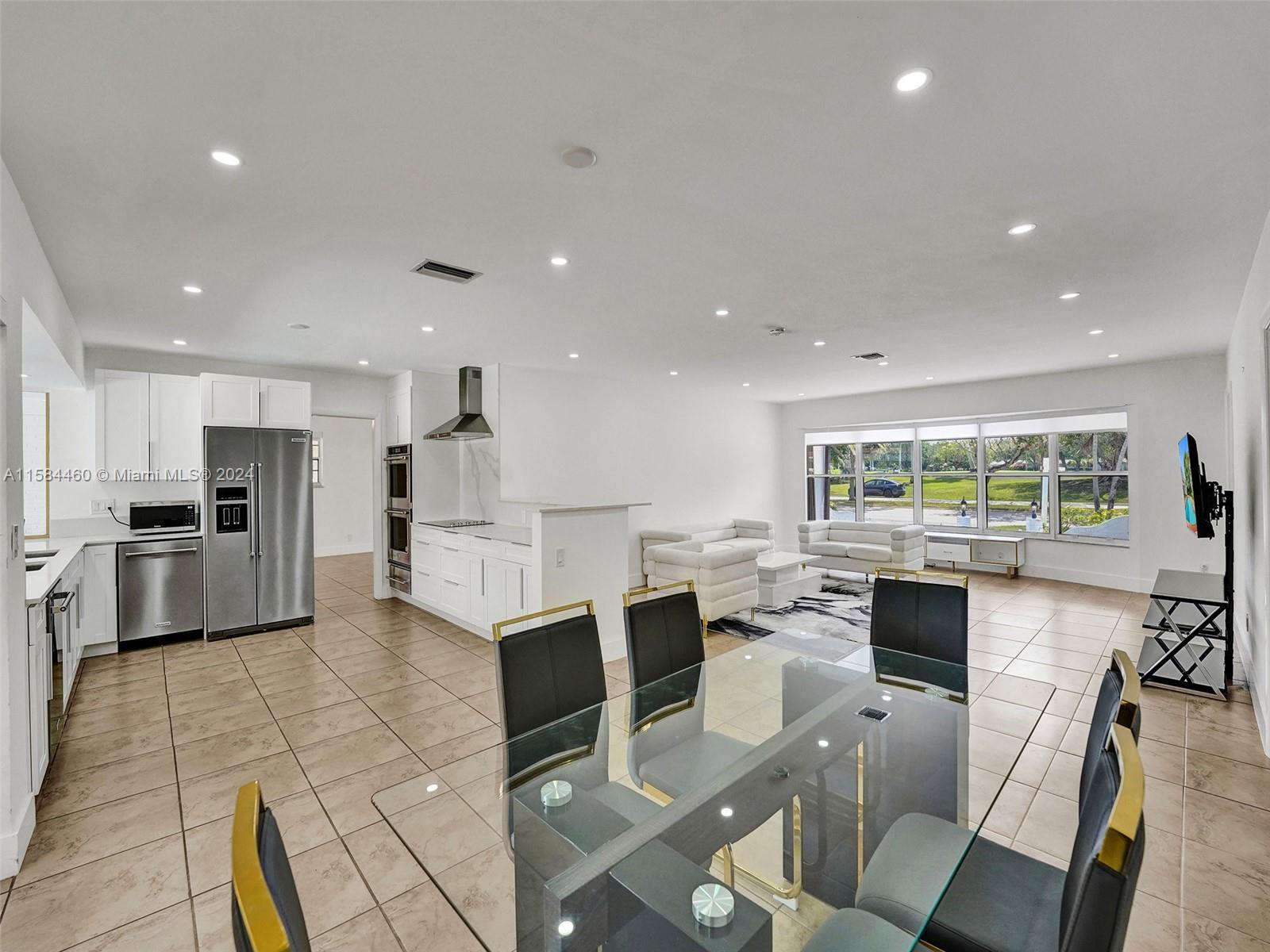 3460 North 46th Avenue Hollywood, FL 33021 - Photo 14 of 35 a large kitchen with lots of counter space and stainless steel appliances
