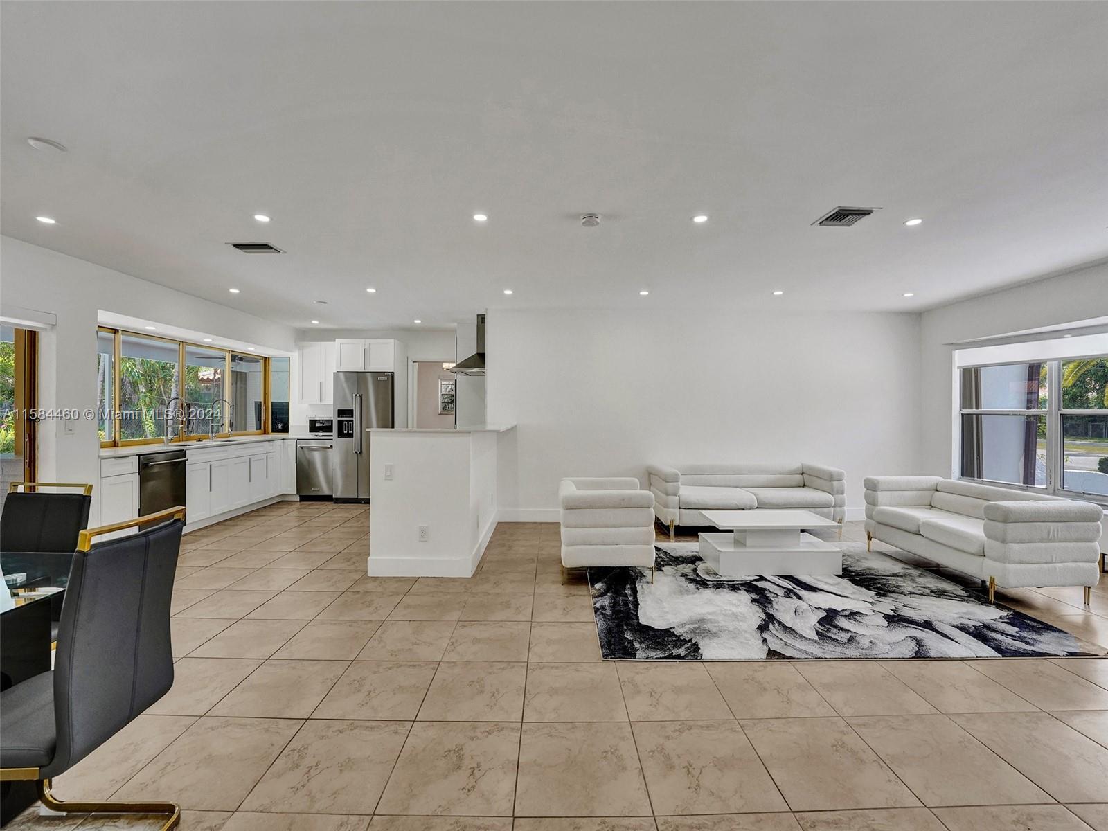 3460 North 46th Avenue Hollywood, FL 33021 - Photo 16 of 35 a living room with furniture and a table