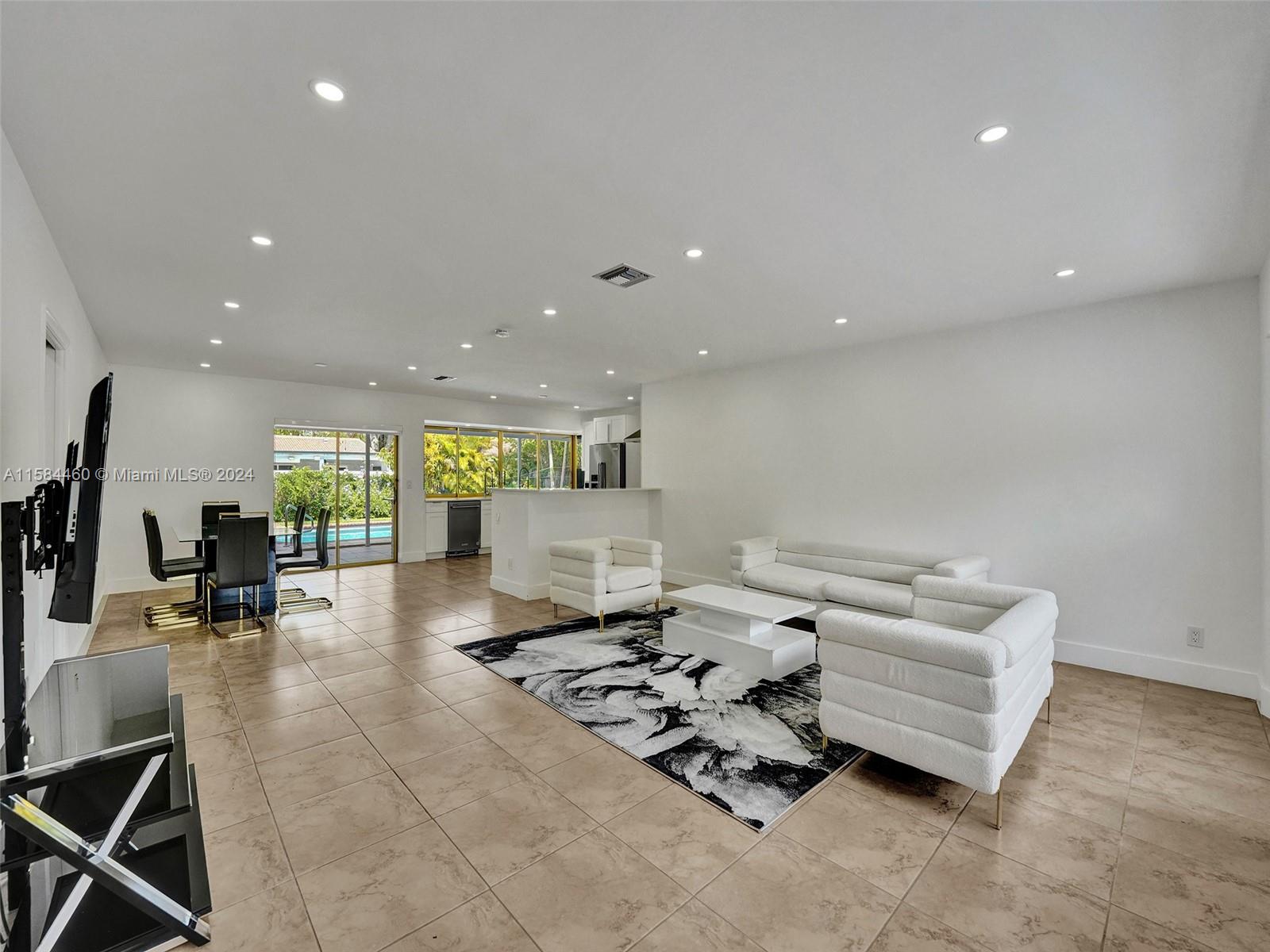 3460 North 46th Avenue Hollywood, FL 33021 - Photo 17 of 35 a living room with furniture and a gym equipment