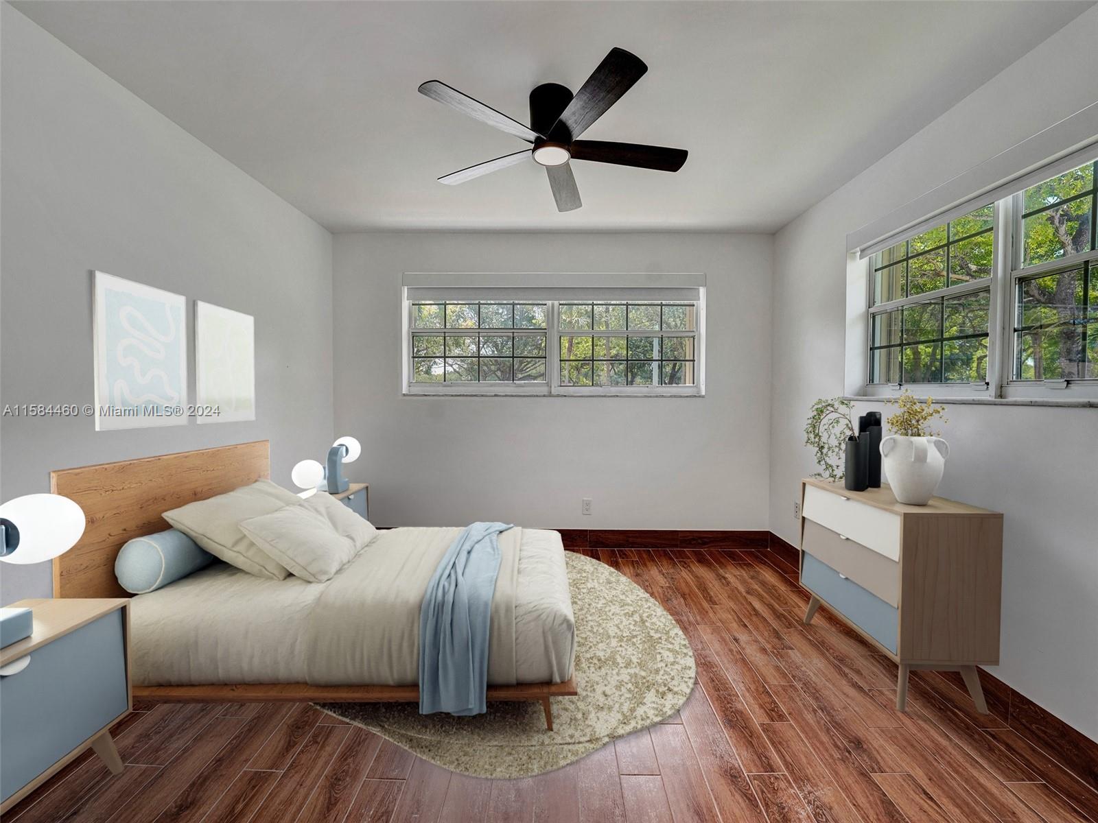 3460 North 46th Avenue Hollywood, FL 33021 - Photo 21 of 35 a bedroom with a bed and wooden floor