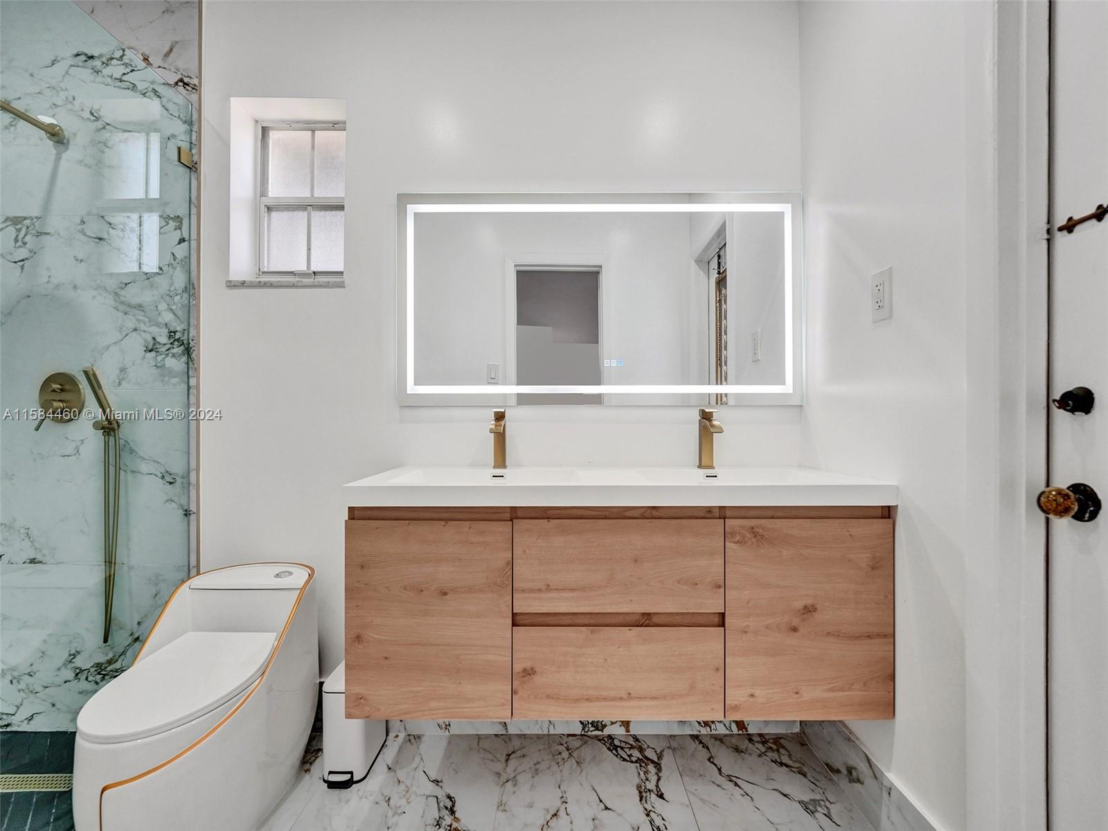 3460 North 46th Avenue Hollywood, FL 33021 - Photo 27 of 35 a bathroom with a sink toilet and shower